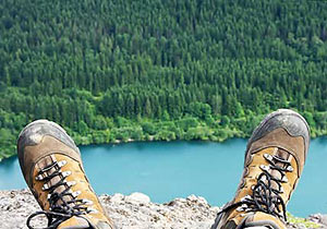 Maine Hiker's Feet on the Edge of a Cliff Overlooking Moosehead Lake